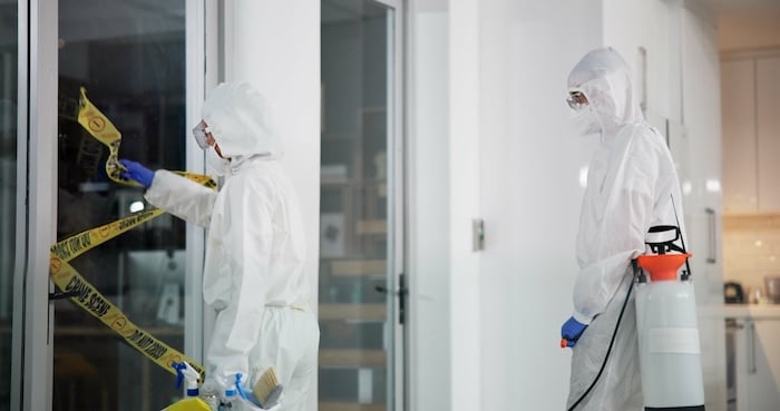 Restoration professionals at a crime scene.