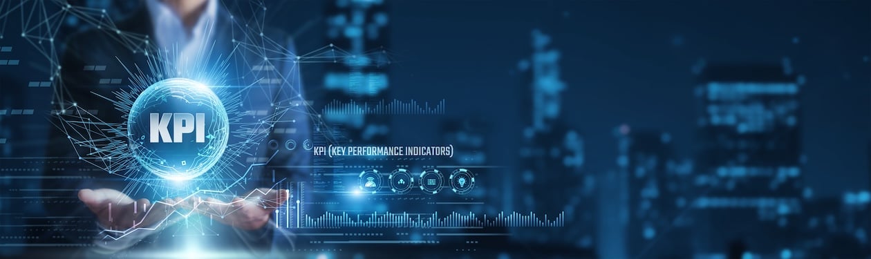 Business professional holding a digital KPI dashboard displaying performance metrics and analytics, representing data-driven decision-making and operational tracking.