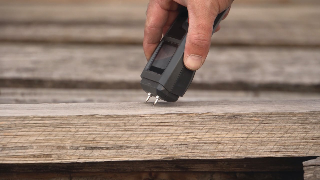 Checking wood with a moisture meter