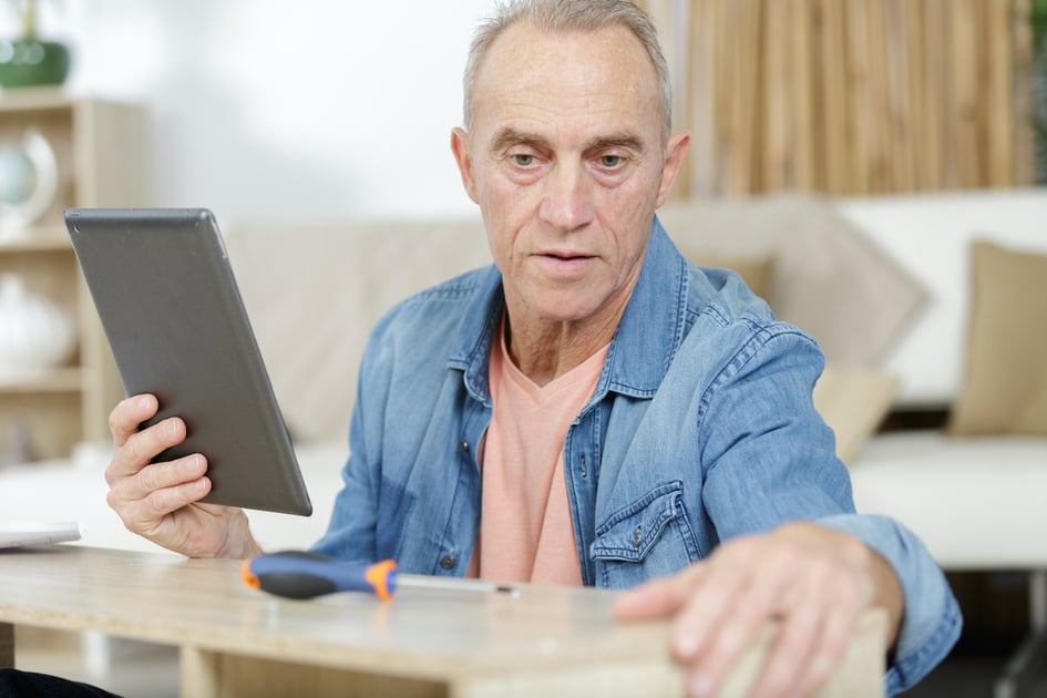 Restoration contractor using an iPad on a work site. 